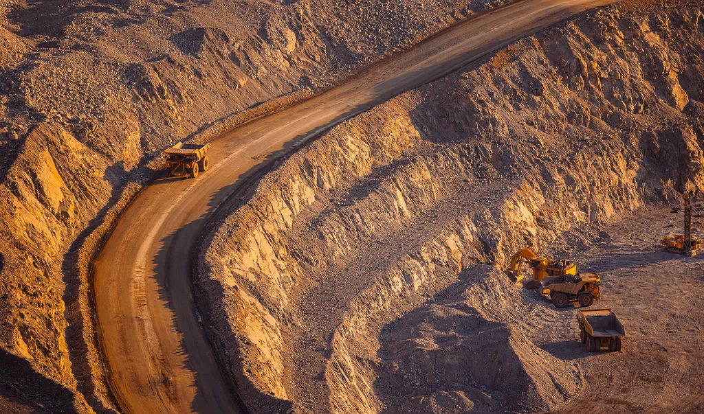 Open-pit mining operation with haul trucks
