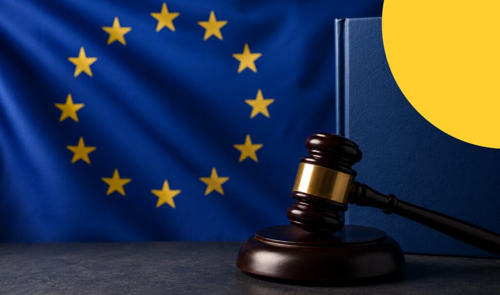 EU flag with a judge's gavel and law book, representing the EU Forced Labour Regulation